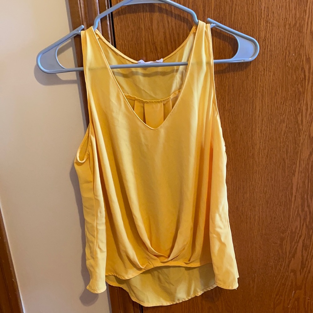 Yellow sleeveless blouse